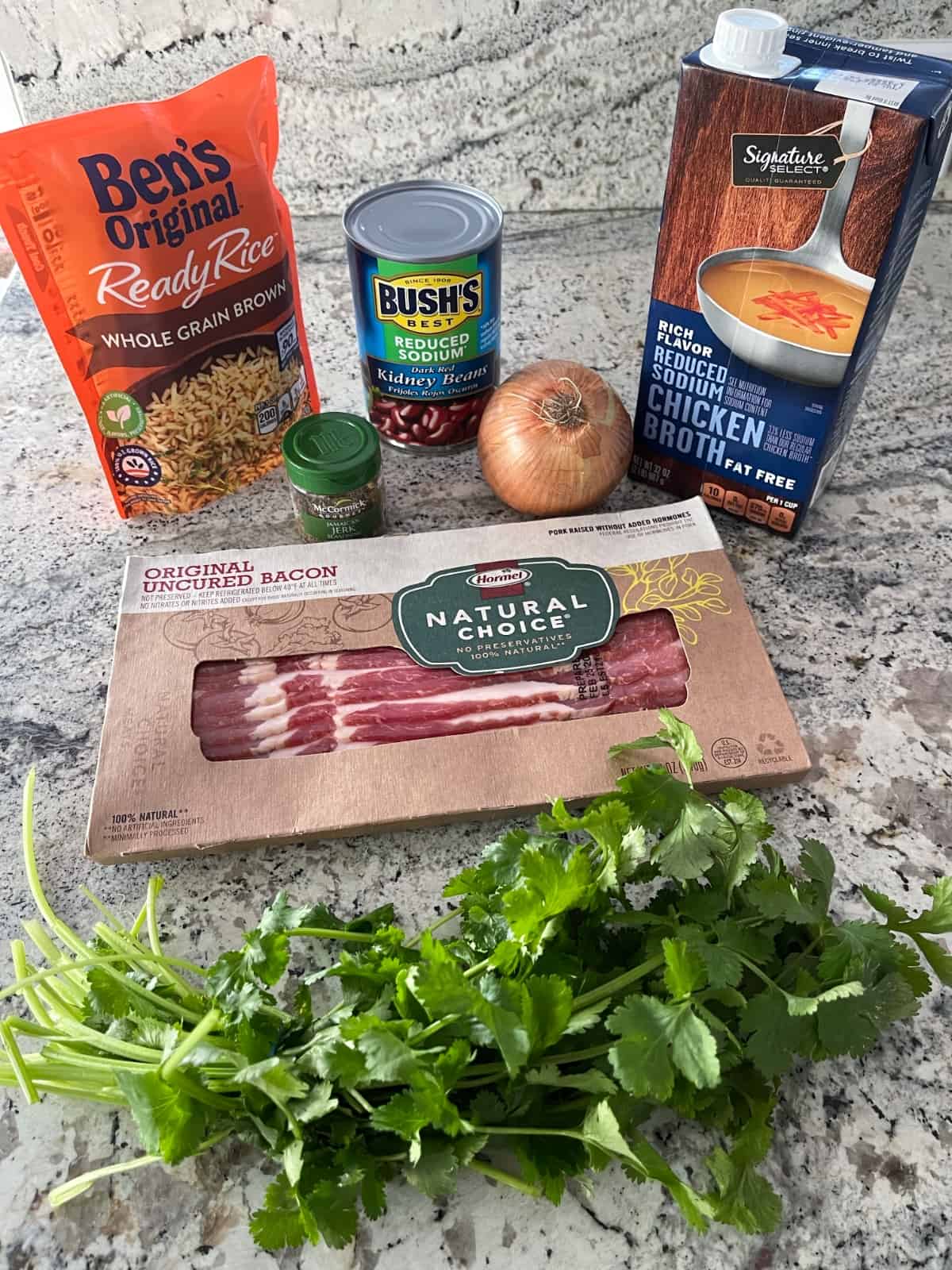 Ingredients including Uncle Ben's Whole Grain Brown Rice, Canned Red Beans, Onion, Chicken Broth, Jamaican Jock Seasoning, Bacon and Cilantro.