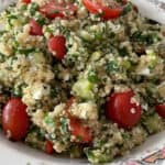 Quinoa Tabbouleh in a flower rimmed china bowl on granite countertop with Text Box: Weight Watchers Quinoa Tabbouleh