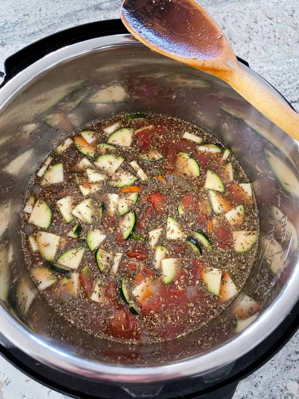 Uncooked lentil minestrone soup in Instant Pot.