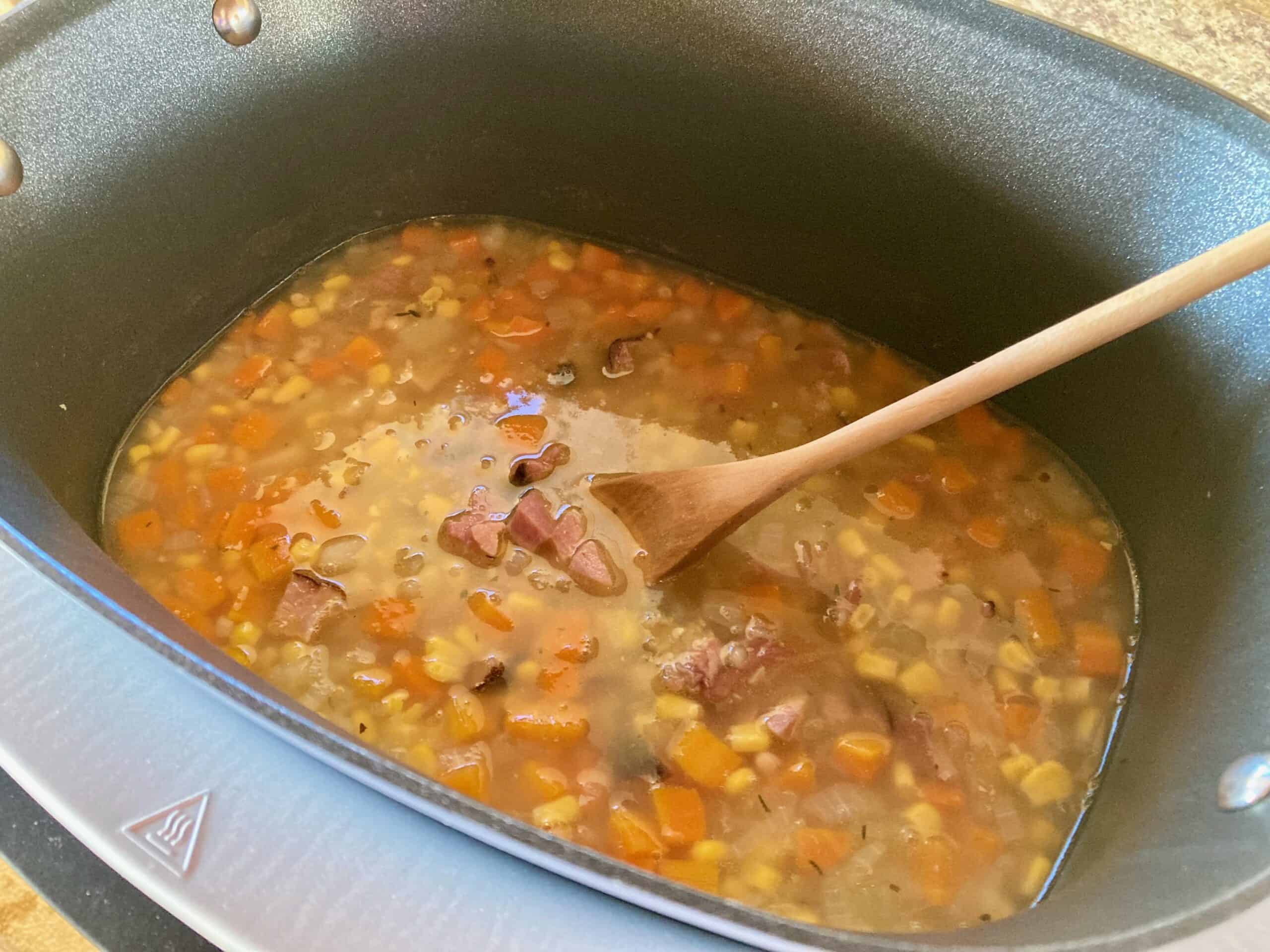 Displaying Cooked Leftover Ham Bone Soup in the Crock Pot ready to be enjoyed