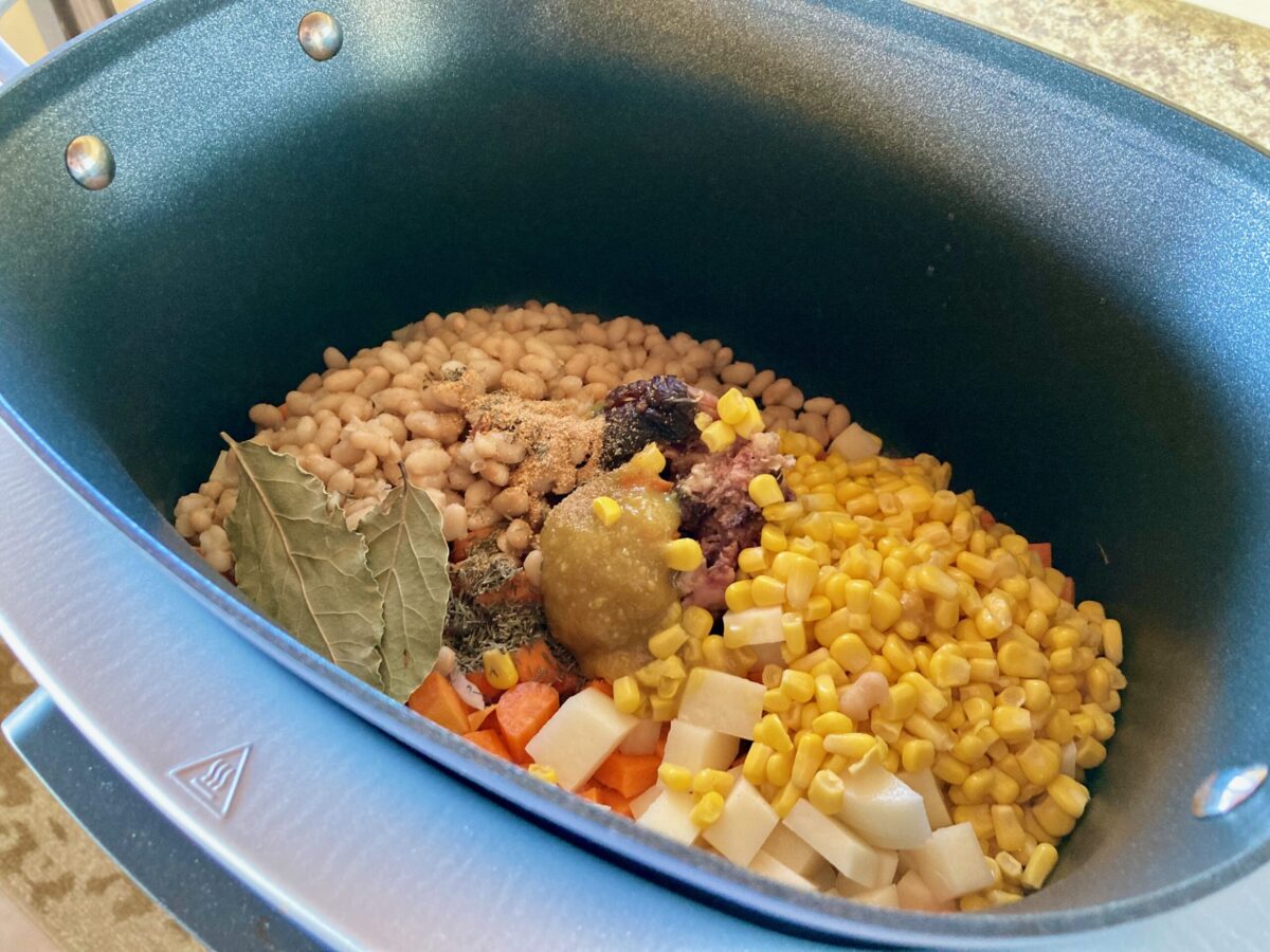 ham bone, beans, corn, onion, carrot, potato, garlic, bay leaves, thyme, bouillon in the crockpot