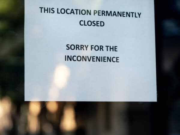 White Paper sign in a Window: This location permanently closed. Sorry for the inconvenience