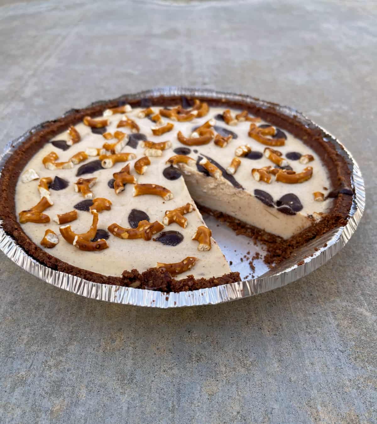 Frozen Peanut Butter Pie with one slice missing.