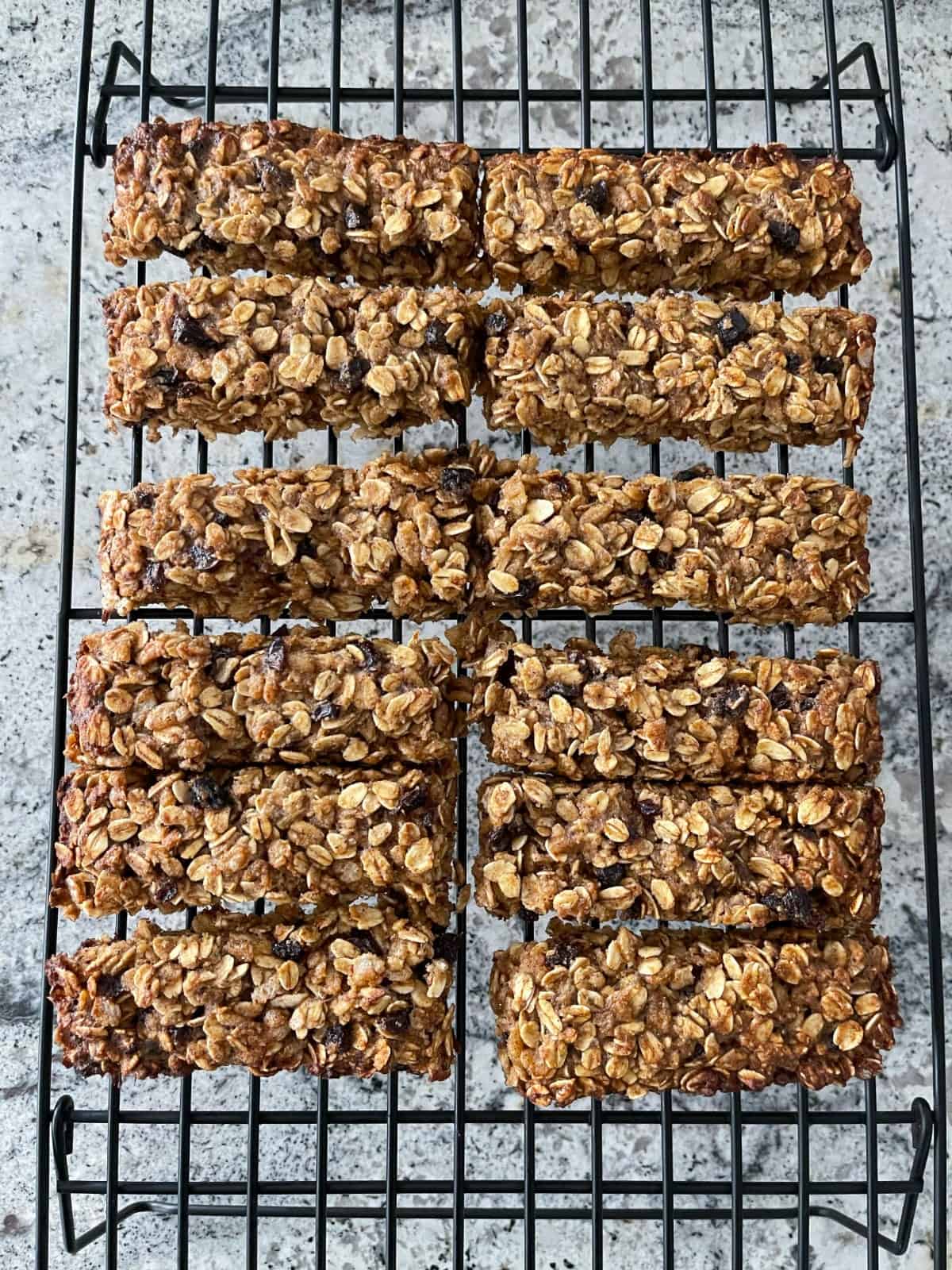 12 gluten-free oatmeal spice bars cooling on wire rack.