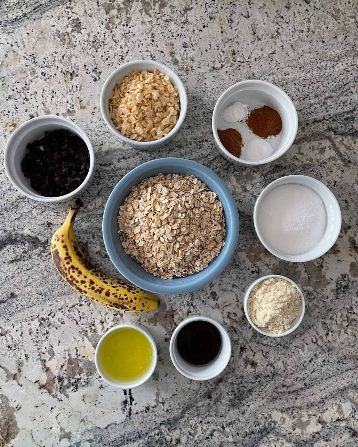 Ingredients including rolled oats, crispy rice cereal, raisins, banana, almond flour, canola oil, molasses, Truvia Baking Blend, ground cinnamon and nutmeg.