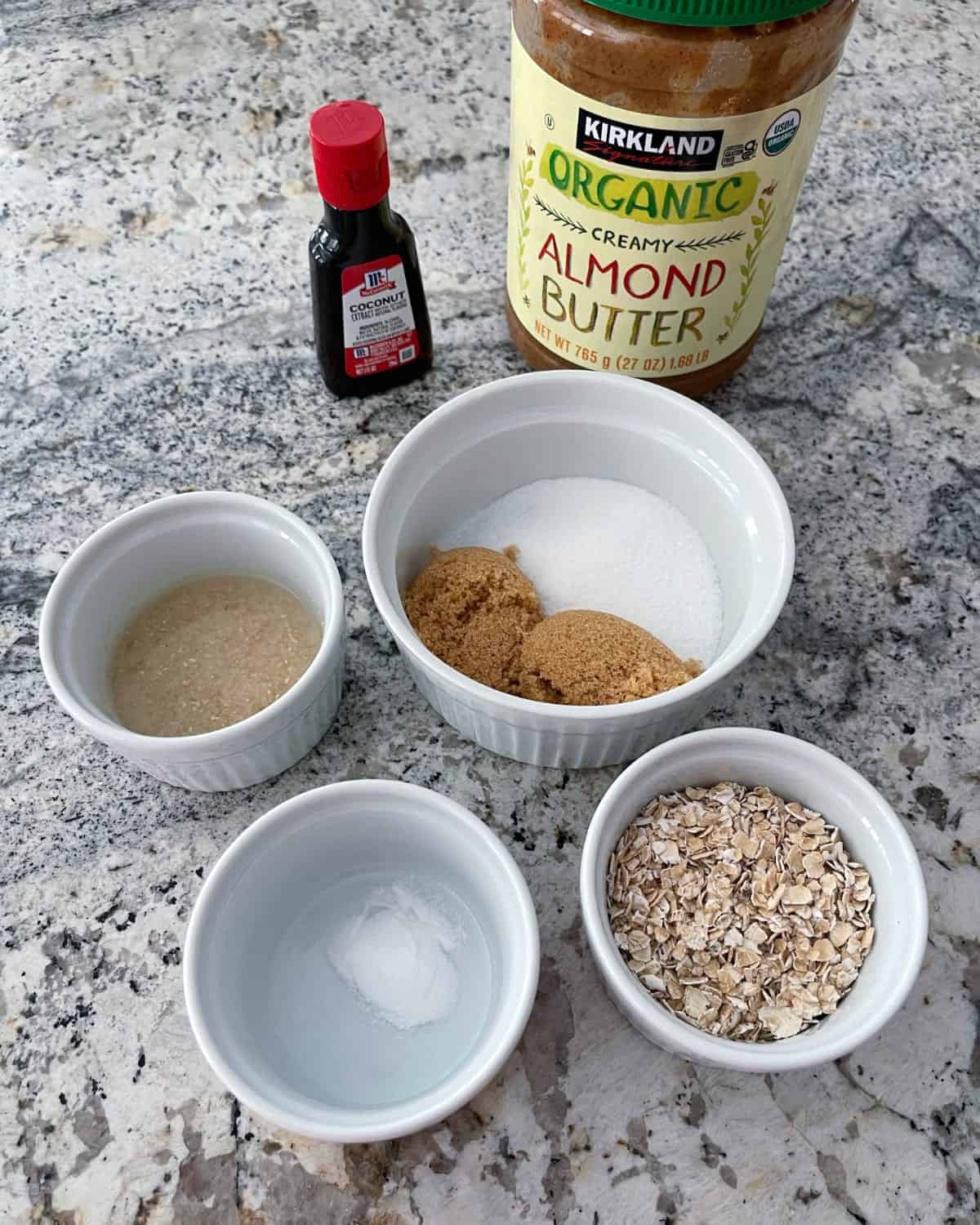 Ingredients including creamy almond butter, coconut extract, rolled oats, baking soda, Truvia Baking Blend and ground flax seeds.