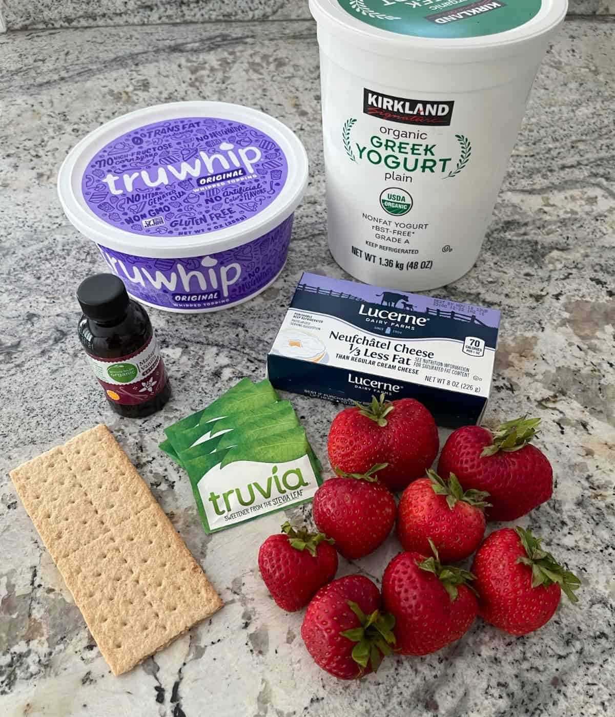 Ingredients including TruWhip, plain nonfat Greek yogurt, reduced-fat cream cheese, fresh strawberries, Truvia packets, vanilla extract and graham cracker.