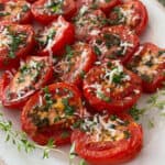 Parmesan Broiled Tomatoes decoratively arranged on antique china oval platter