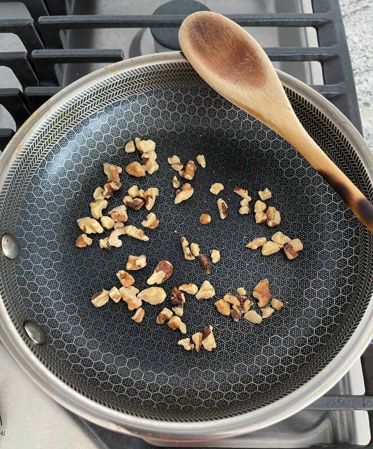 Toasting walnuts in small dry skillet.
