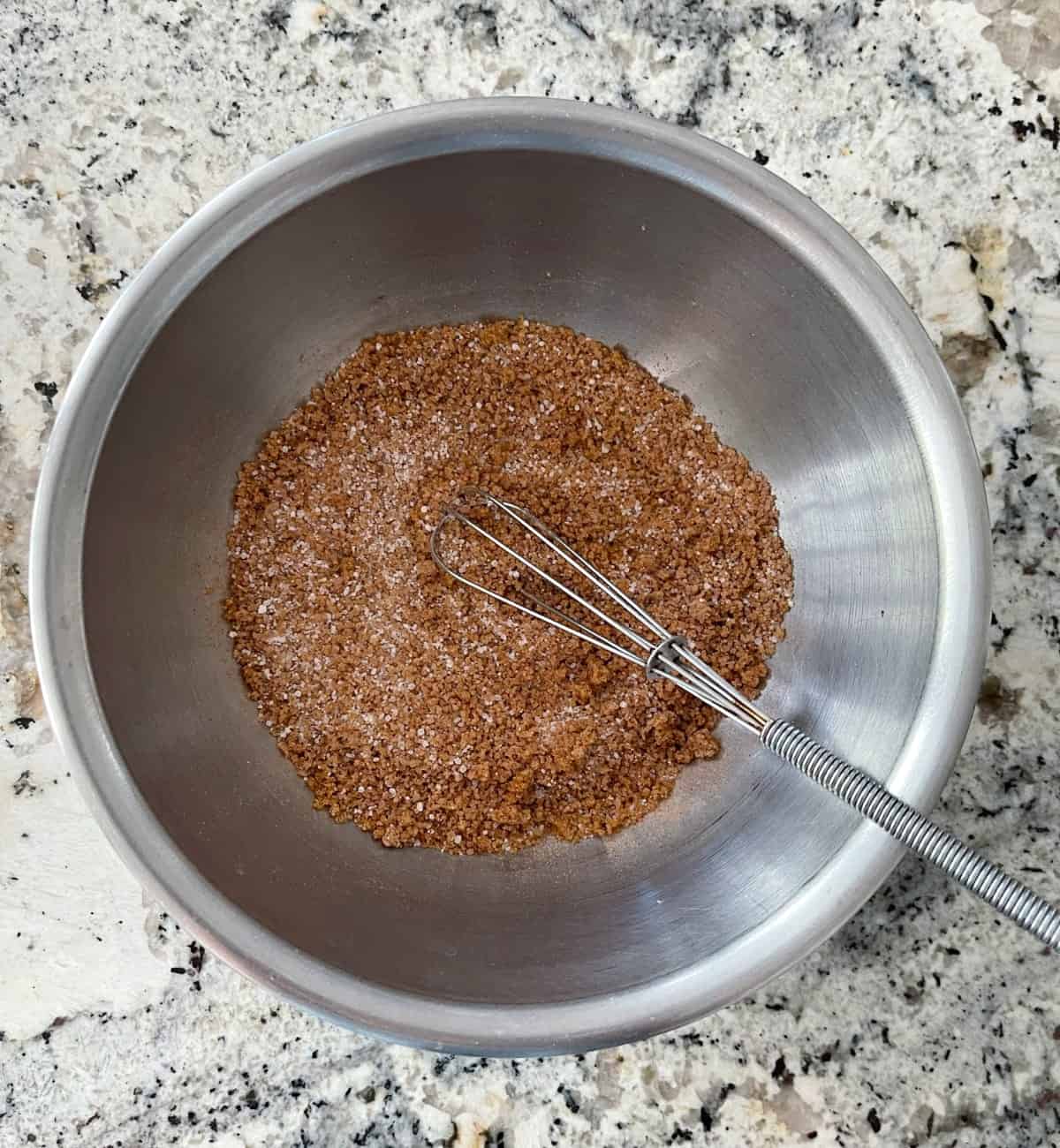 Whisking Truvia brown sugar, Truvia baking blend and cinnamon in mixing bowl.