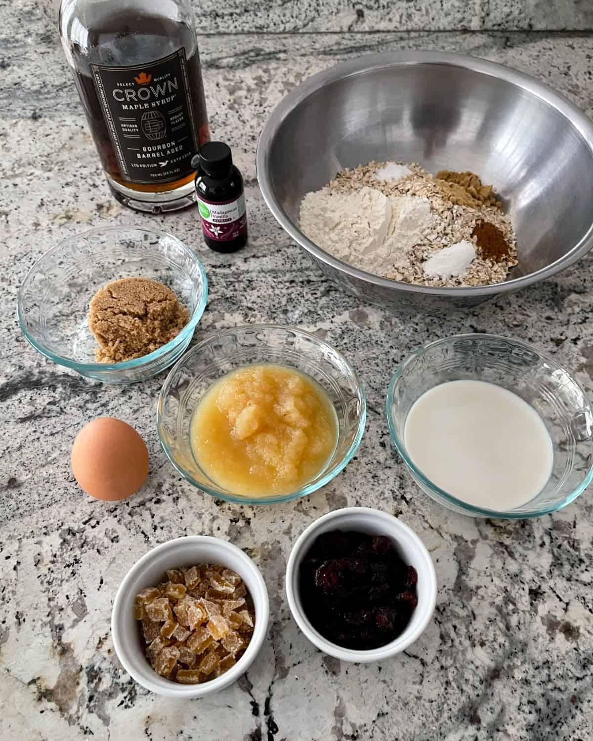 Ingredients including bourbon barrel aged pure maple syrup, vanilla extract, oats, flour, cinnamon, Truvia brown sugar blend, egg, applesauce, unsweetened almond milk, dried cranberries and chopped candied ginger.