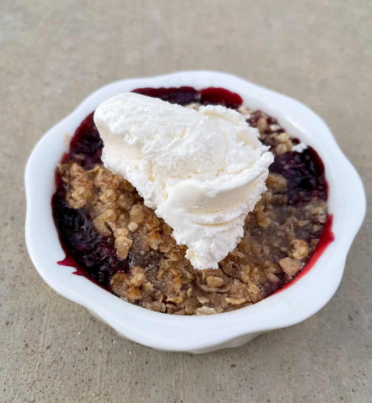 Cherry berry crumble crunch dessert topped with light whipped topping.