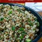 lemony lentil quinoa salad in dark blue pottery bowl with text boxes for Pinterest PIN