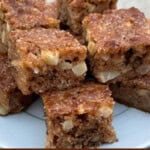 Stack of apple nut bars made lighter on white plate with text box for Pinterest PIN