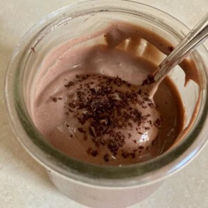 glass jar of Mocha Chocolate Yogurt with spoon close up
