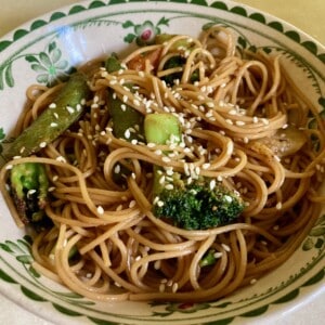 vegetable lo mein in decorative ceramic bowl shot from the front