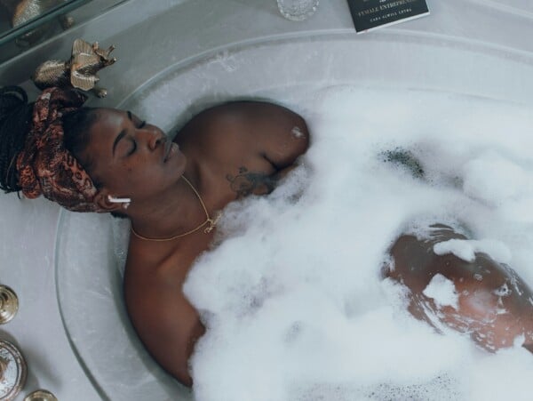 Woman resting in a bubble bath