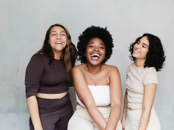 3 very unique women smiling