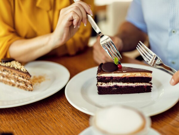Man & Woman at a table sharing dessert