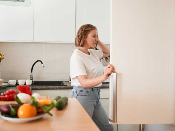 Woman looking into the refrigerator