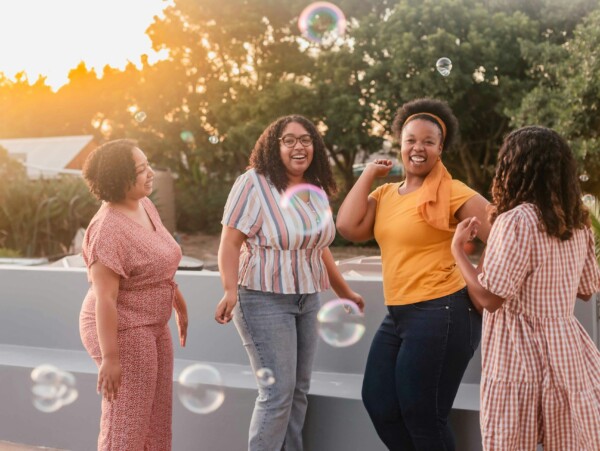 Four South African Women Celebrating with One Another