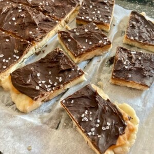 Frozen Peanut Butter Banana Chocolate Bark on a Parchment Lined Cookie Sheet Ready to Enjoy