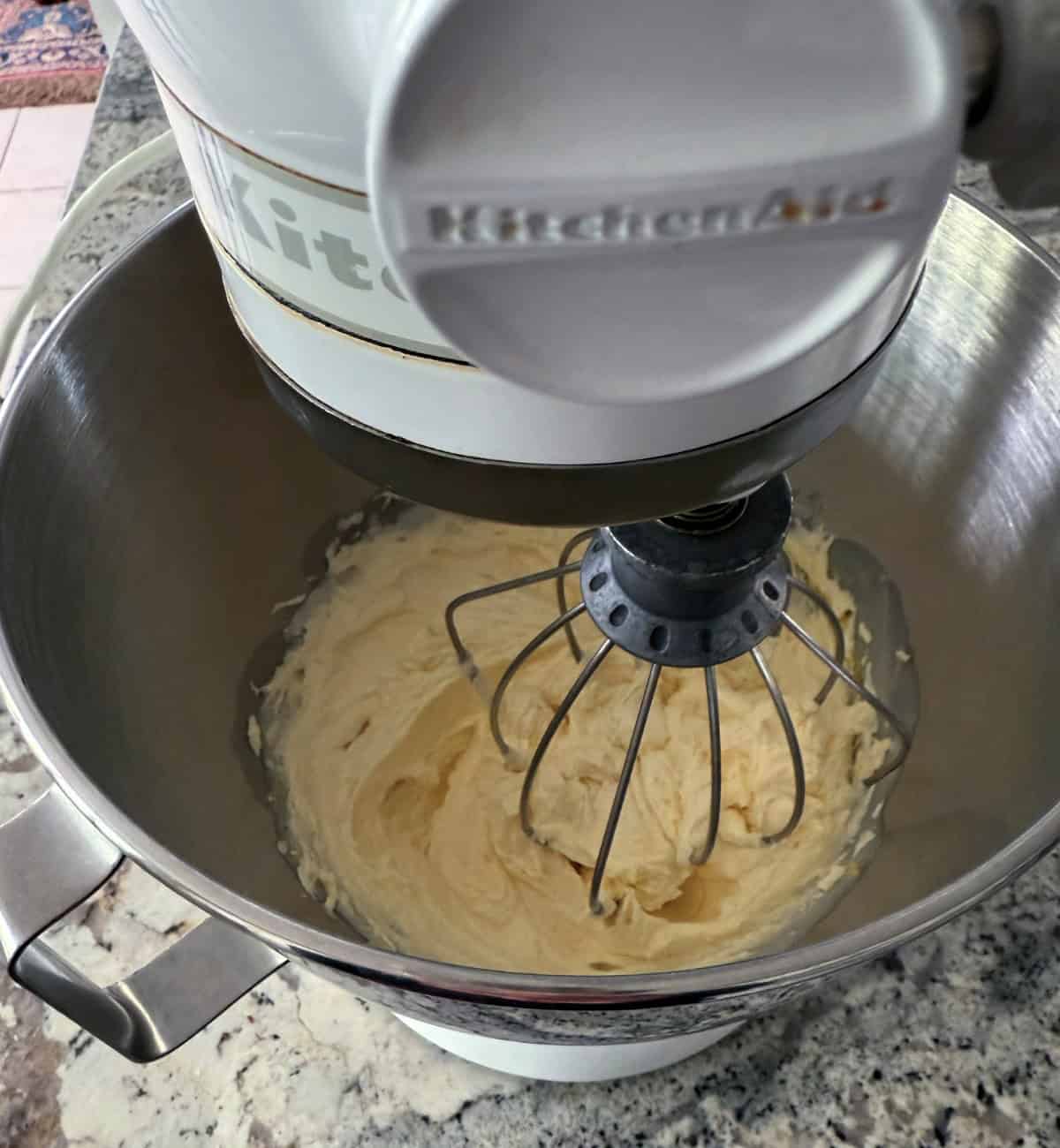Using KitchenAid electric mixer to beat butter, granulated sweetener and lemon zest.