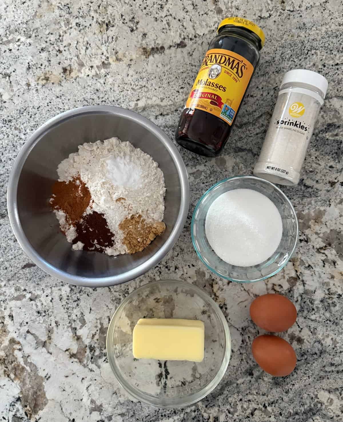 Ginger Cookie ingredients, including molasses, no calorie sweetener, all-purpose flour, cinnamon, ginger, nutmeg, eggs, butter and sparkling sugar.