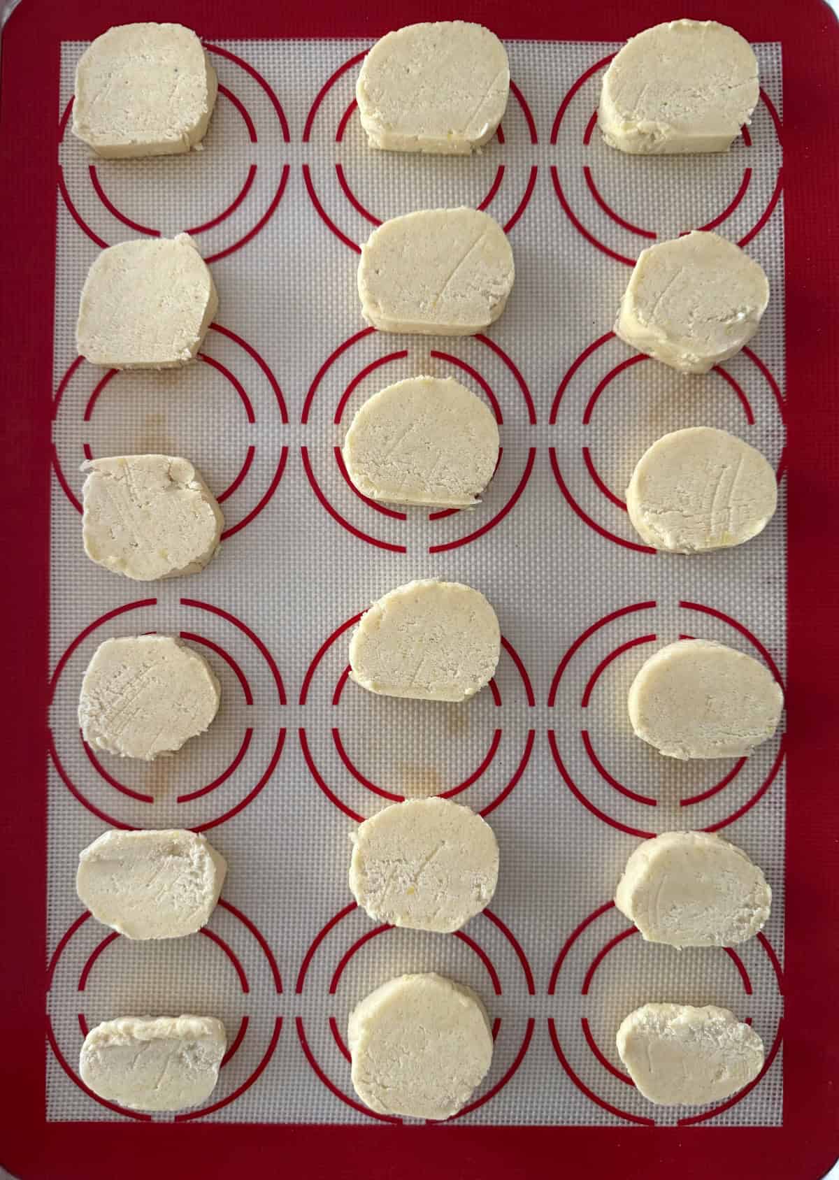 Unbaked lemon shortbread cookies on baking sheet.