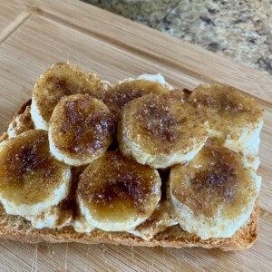 Bananas Foster Cottage Cheese Toast on Bamboo Cutting Board