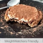 5 minute tiramisu rice cake on a black ceramic plat with spoon in background