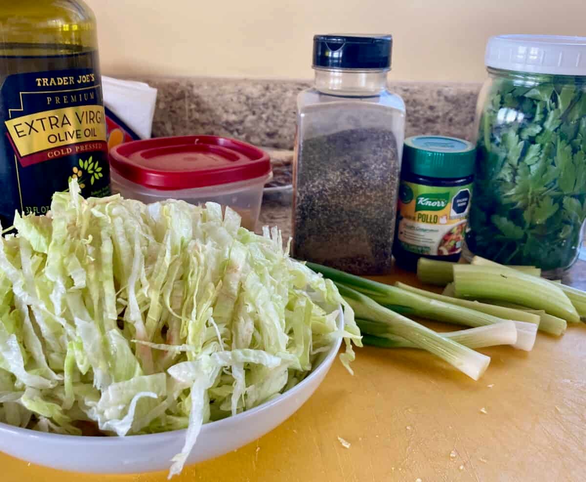 Shredded lettuce, scallions, black pepper, bouillon, olive oil, black pepper for Italian Style Lettuce Soup.
