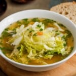bowl filled with shredded lettuce soup