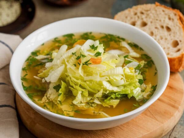 bowl filled with shredded lettuce soup