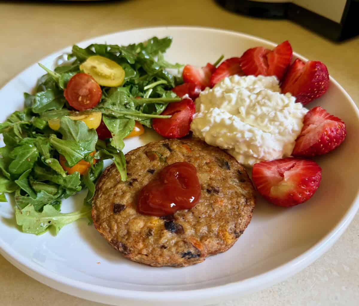 veggie burger, salad, cottage cheese, berries