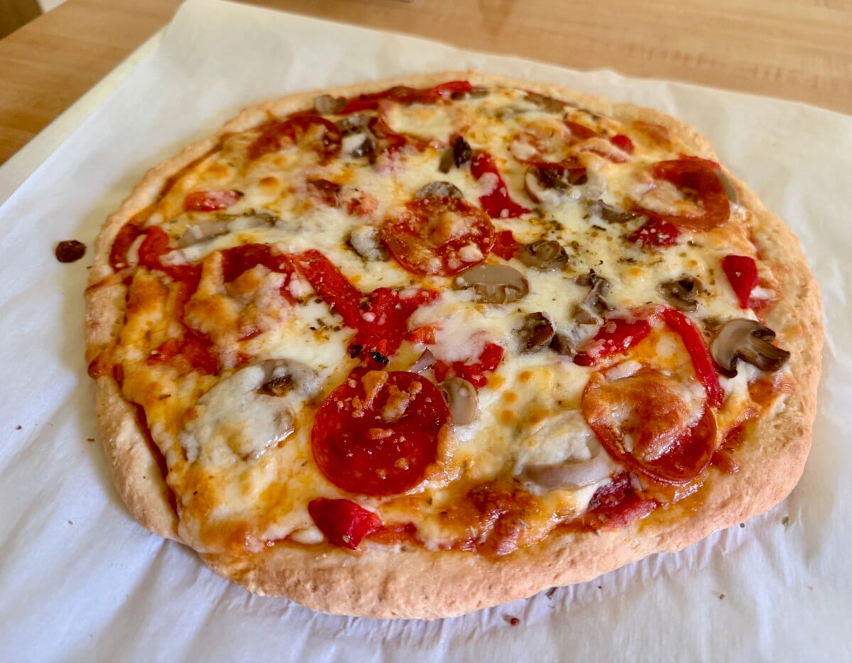 2-ingredient dough pizza on parchment paper