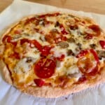 2-ingredient dough pizza on parchment paper