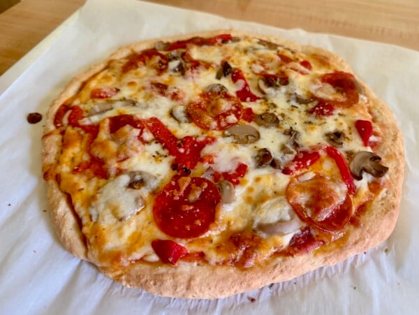 2-ingredient dough pizza on parchment paper