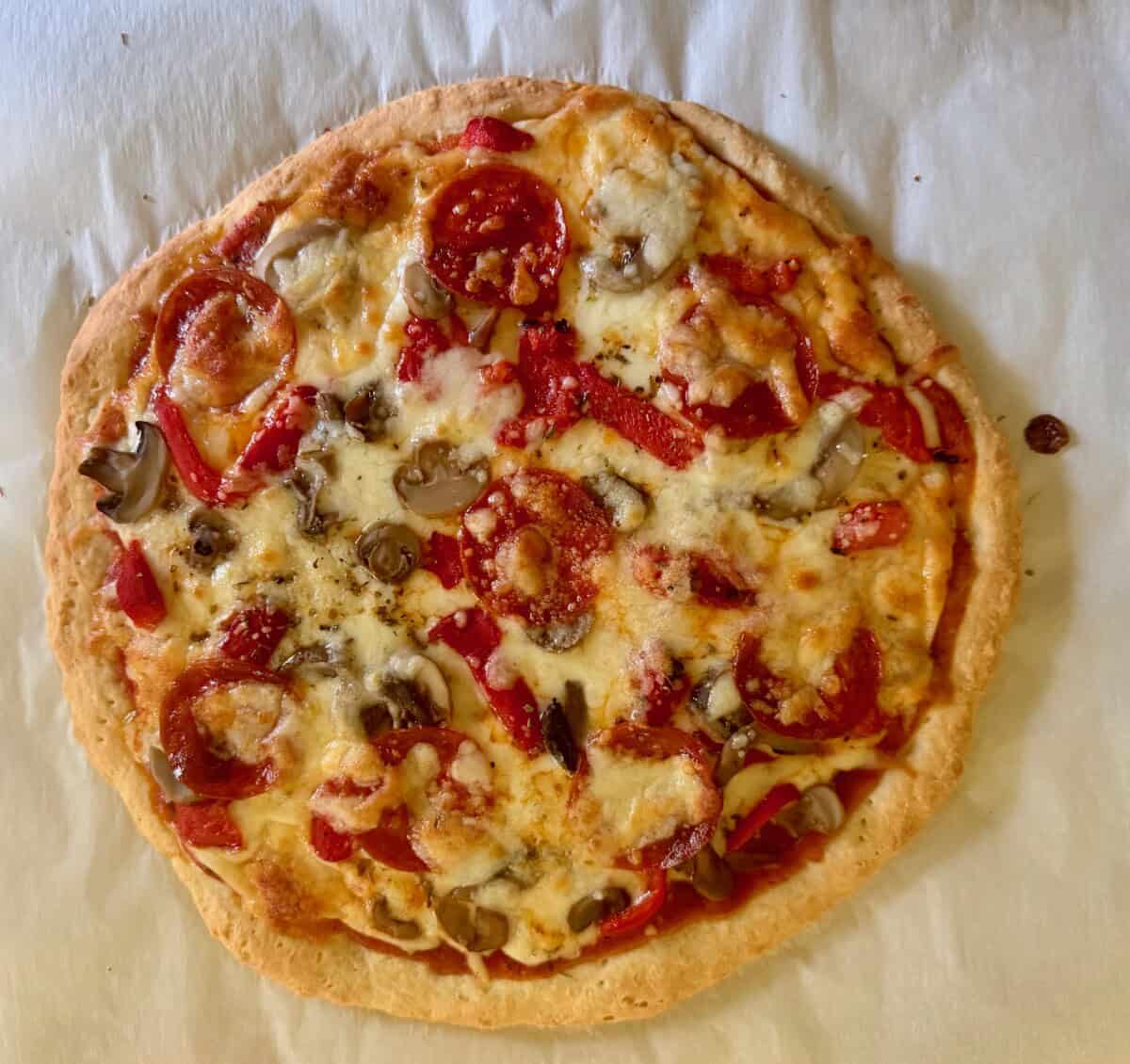 2 ingredient dough pizza on parchment paper